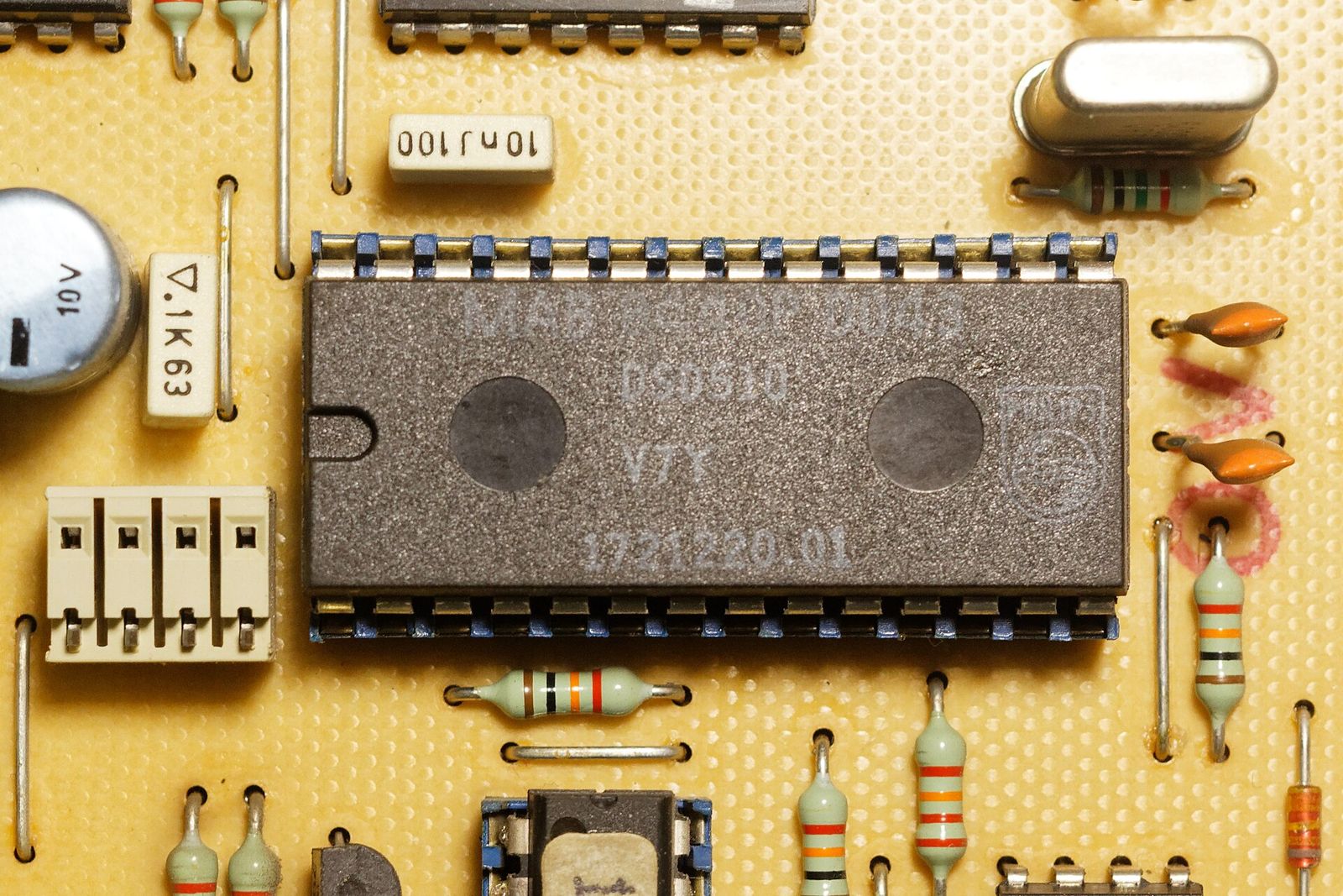 Close-up of a populated printed circuit board with a microcontroller